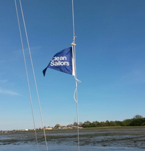 Load image into Gallery viewer, Clean Sailors upcycled burgee on a boat
